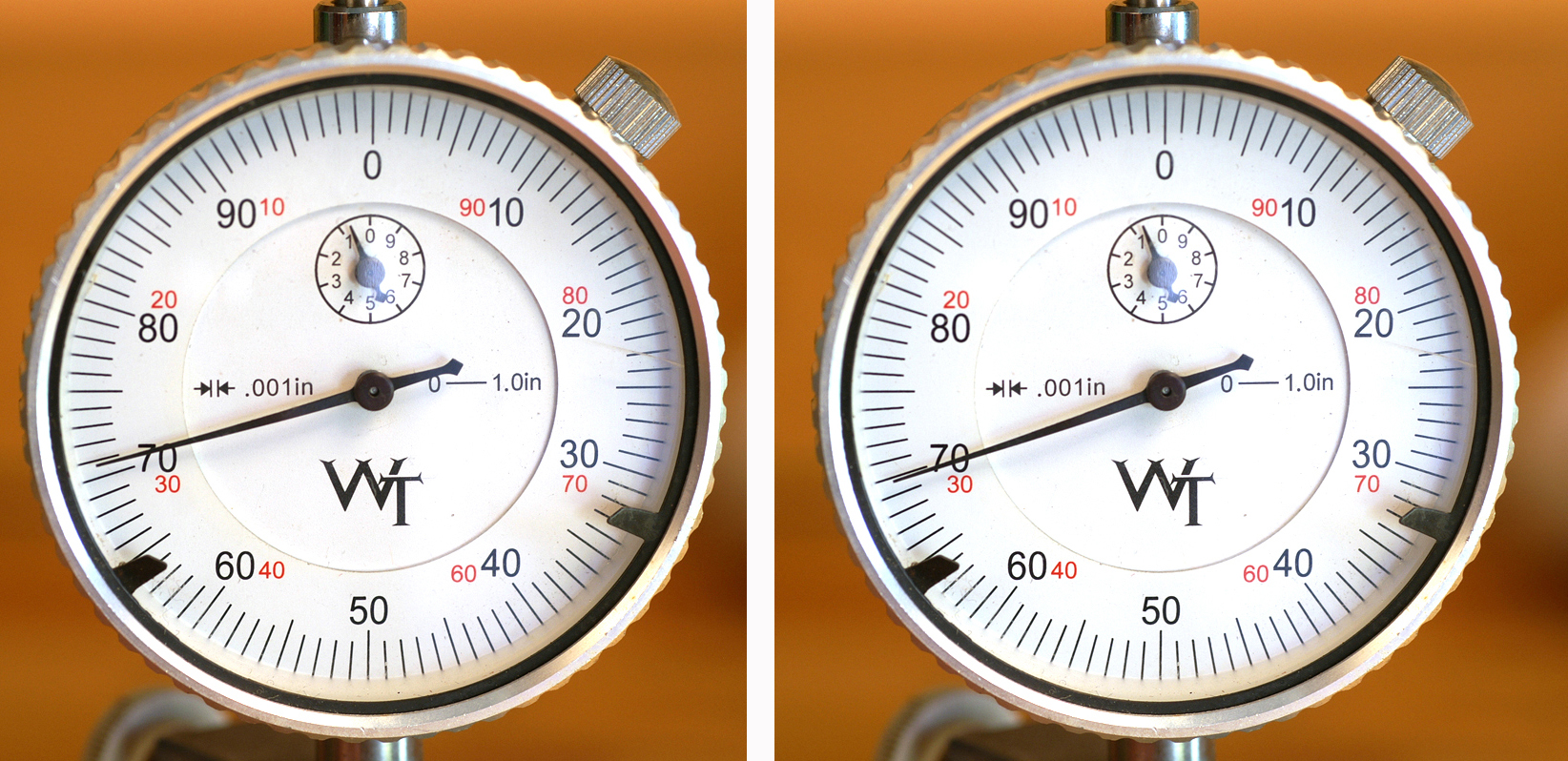 This pair of photos shows the amount of warp on a fired case measured using a V-block-style concentricity fixture with a dial indicator. As before, the “70” on the dial indicator is just the position of the indicator. What matters is the area the indicator sweeps, which shows they are a little less perfect than the new ones above.