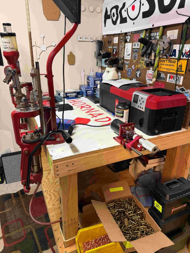 A 4x4 reloading bench with Hornady gear and word Hornady painted in that iconic Hornady red color.