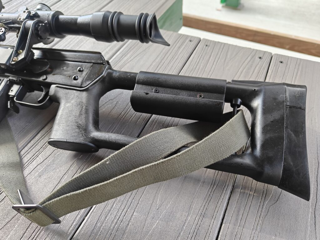 Stock of rifle on bench