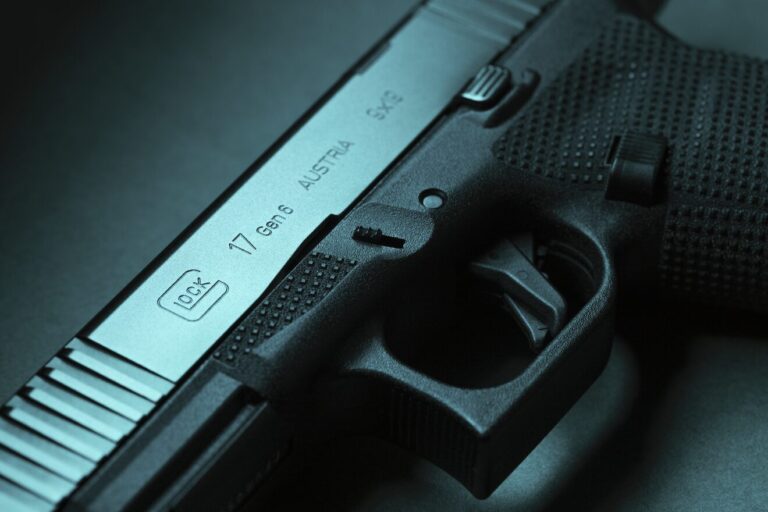 Side of a Glock pistol on table