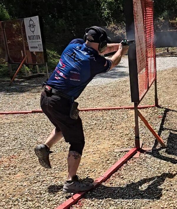 man shooting pistol in competition
