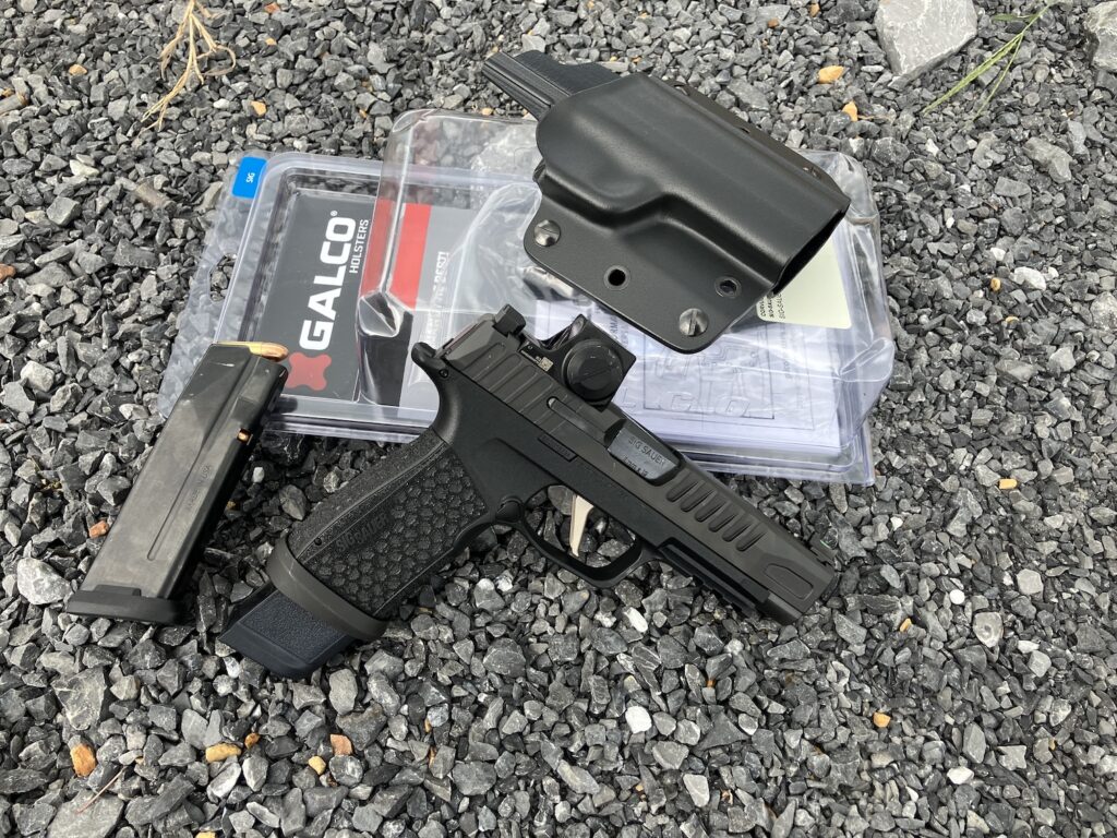 pistol on ground with holster