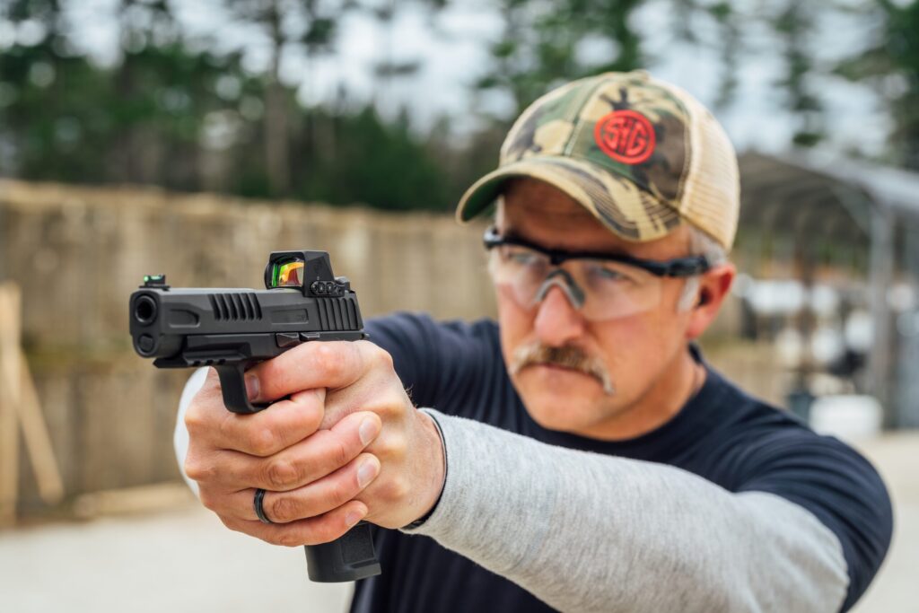 man shooting pistol