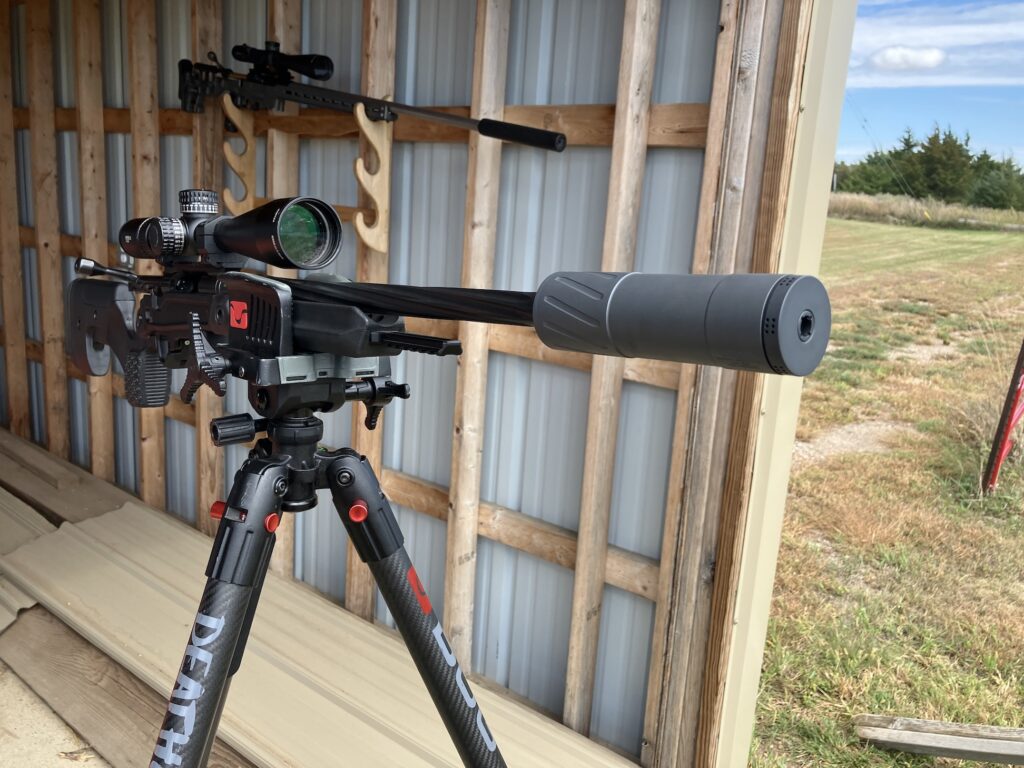 Suppressor on rifle at range