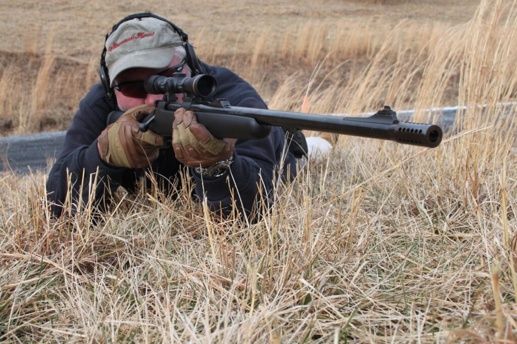 Man holding rifle in prone