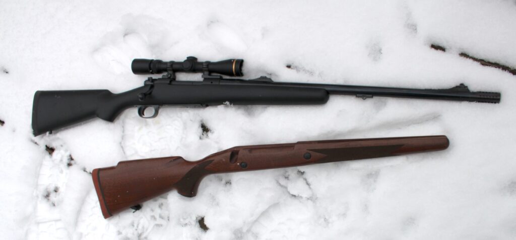 stock option and rifle on snow