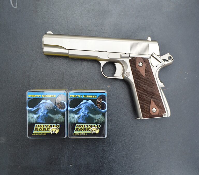 Photo of gun and 38 super ammo